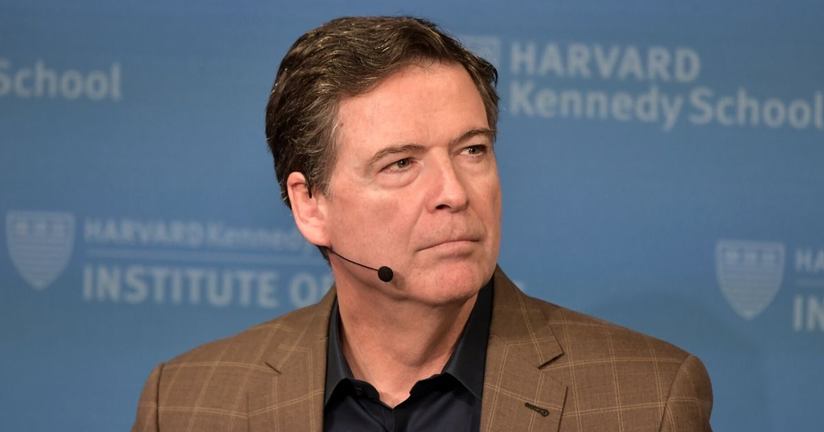 Former FBI Director James Comey speaks at Harvard Kennedy School with Harvard's Eric Rosenbach on Feb. 24, 2020, in Boston.