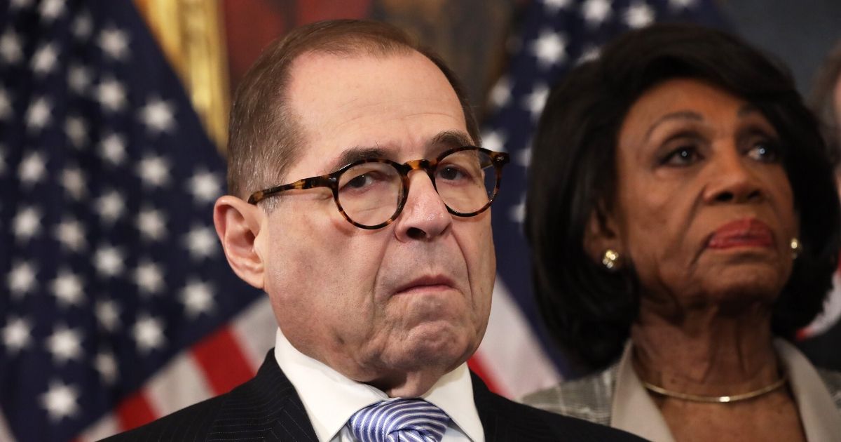 Democratic Reps. Jerrold Nadler of New York, the chairman of House Judiciary Committee, and Maxine Waters of California, the chairwoman of the House Financial Services Committee, listen during a news conference at the U.S. Capitol on Dec. 10, 2019, in Washington, D.C.