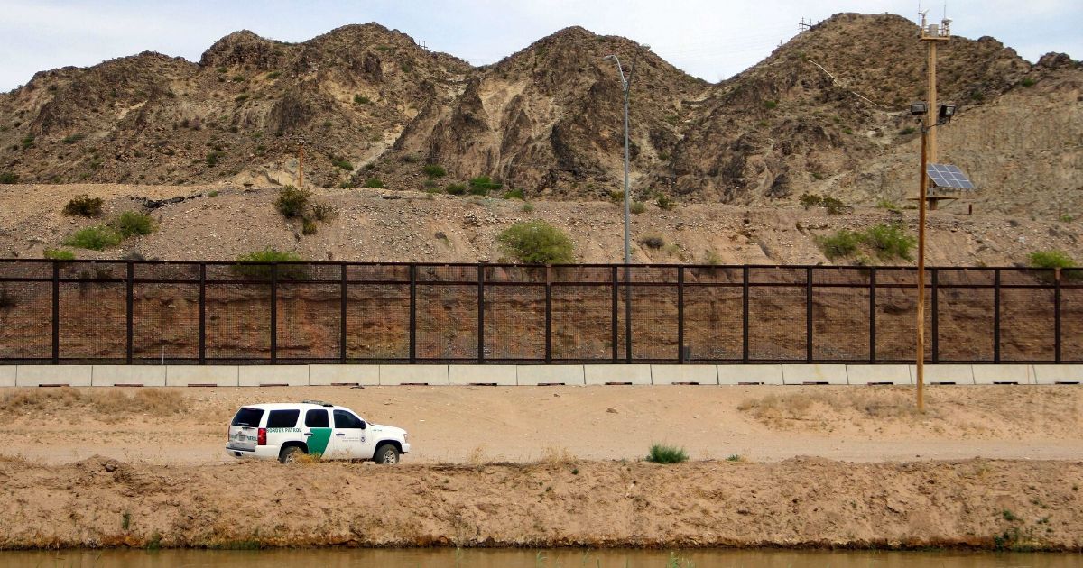 A US Border Patrol is seen from Mexico while patrolling along the border line between the cities of El Paso, Texas, in the United States, and Ciudad Juarez, Chihuahua state, Mexico on April 7, 2018.