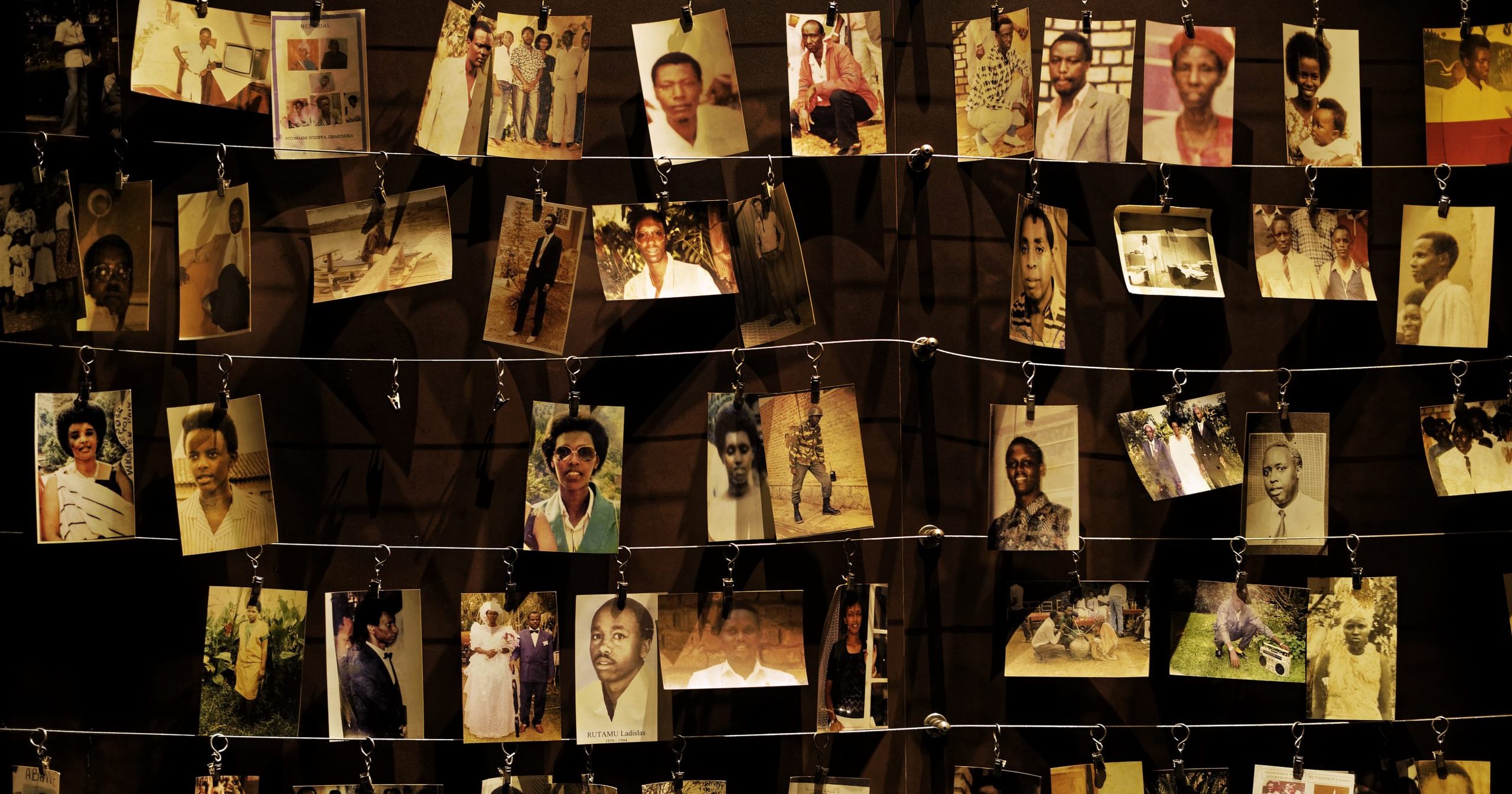 In this April 5, 2019, file photo, family photographs of some of those who died hang on display in an exhibition at the Kigali Genocide Memorial centre in the capital Kigali, Rwanda.