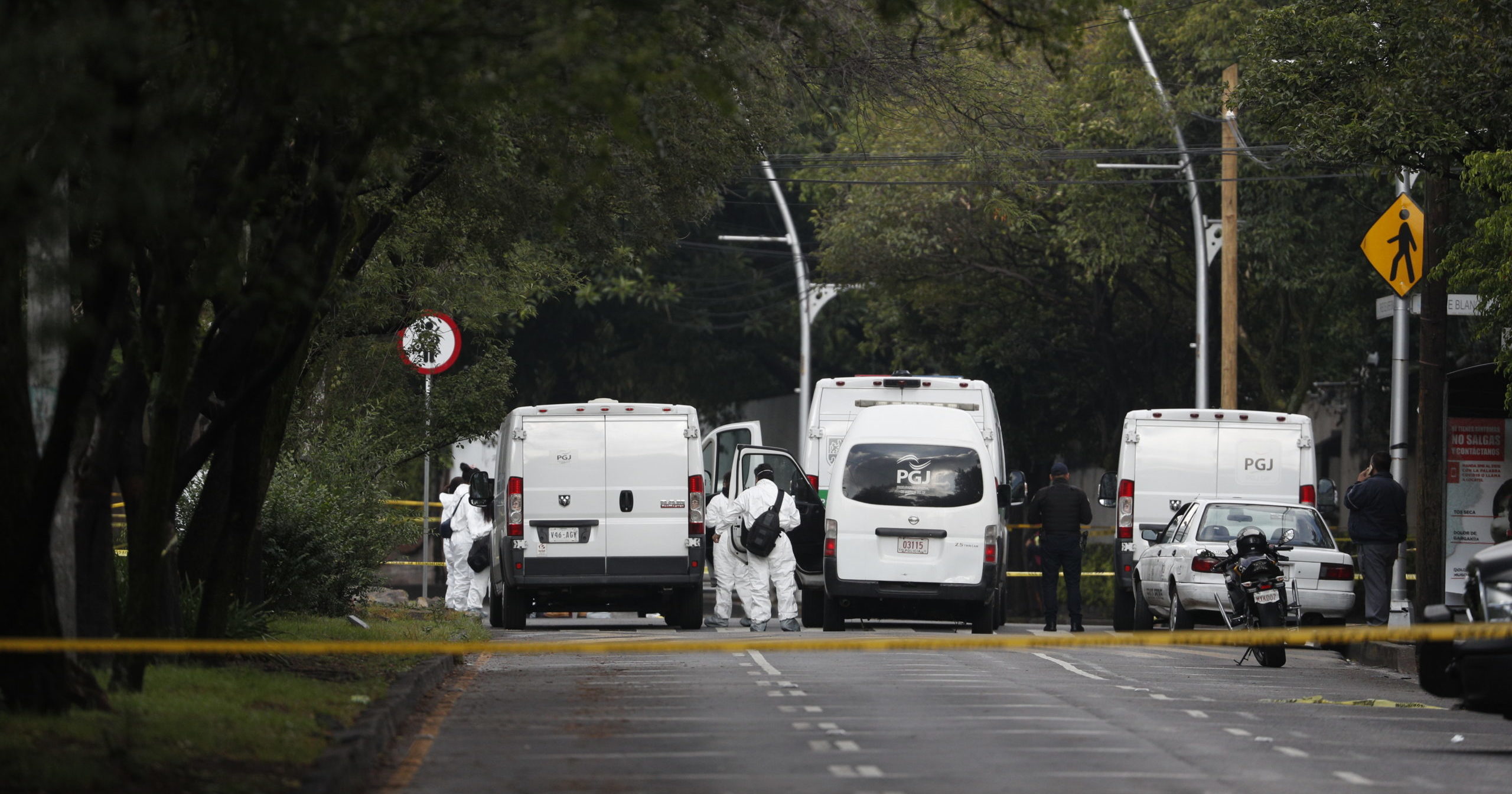 Forensic investigators and police work the scene where Security Secretary Omar García Harfuch was attacked by gunmen in Mexico City on June 26, 2020.