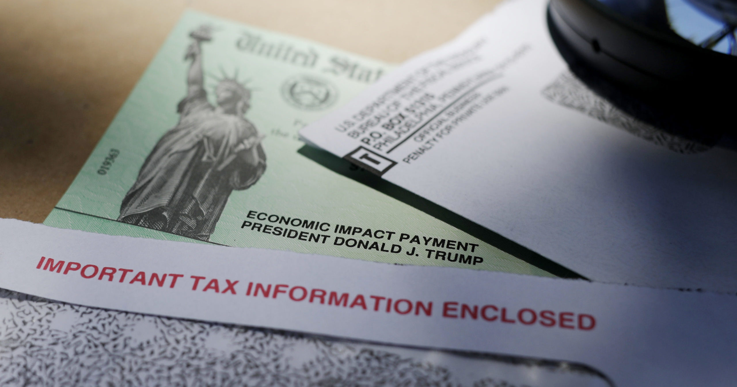 President Donald Trump's name is seen on a stimulus check issued by the IRS to help combat the adverse economic effects of the COVID-19 government shutdowns.