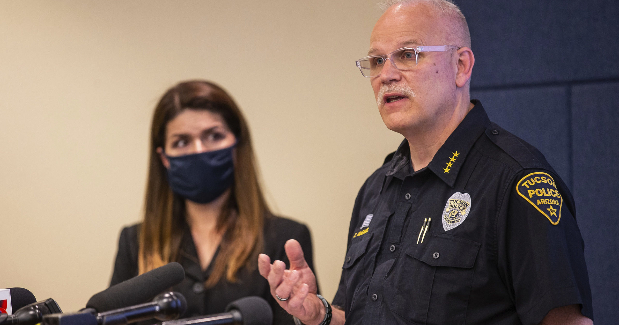 Tucson Police Chief Chris Magnus, right, speaks as Mayor Regina Romero listens during a news conference on June 24, 2020, in Tucson, Arizona. Chief Magnus offered his resignation after the death of a 27-year-old man who died in police custody. The medical examiner’s office didn’t determine a manner of death but said Carlos Ingram-Lopez died of sudden cardiac arrest while intoxicated by cocaine and physically restrained.
