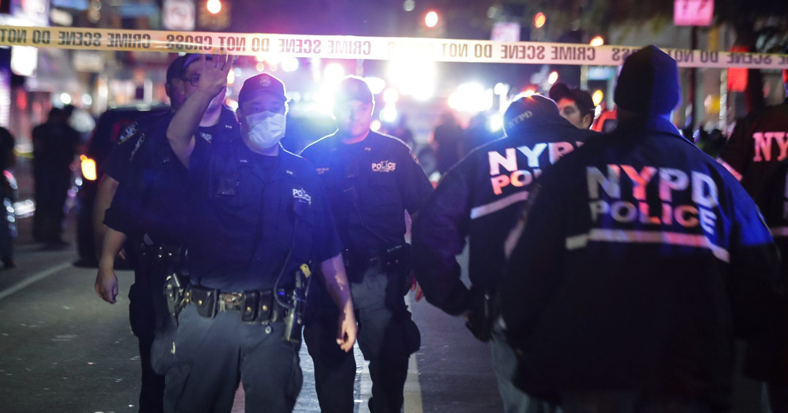 New York City police officers work a scene on June 4, 2020, in the Brooklyn borough of New York. The police department says an officer has been shot in Brooklyn. The shooting happened late Wednesday, nearly four hours after an 8 p.m. curfew went into effect intended to quell unrest over the death of George Floyd in Minnesota.