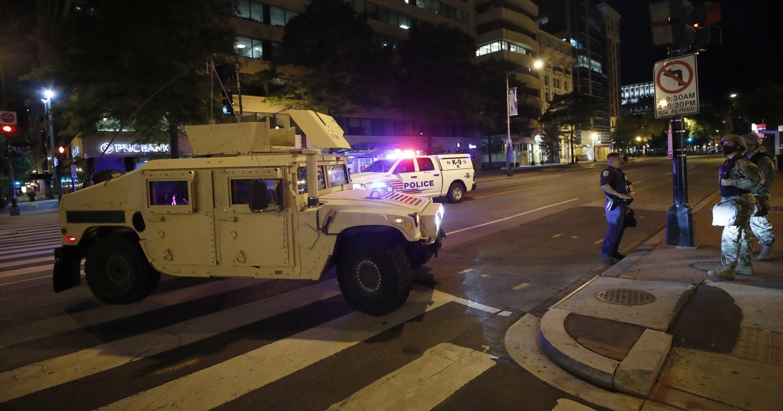 A military Humvee blocks an intersection along K Street in downtown Washington, D.C. as demonstrators protest the death of George Floyd on Monday, June 1, 2020. Floyd died after being restrained by Minneapolis police officers.