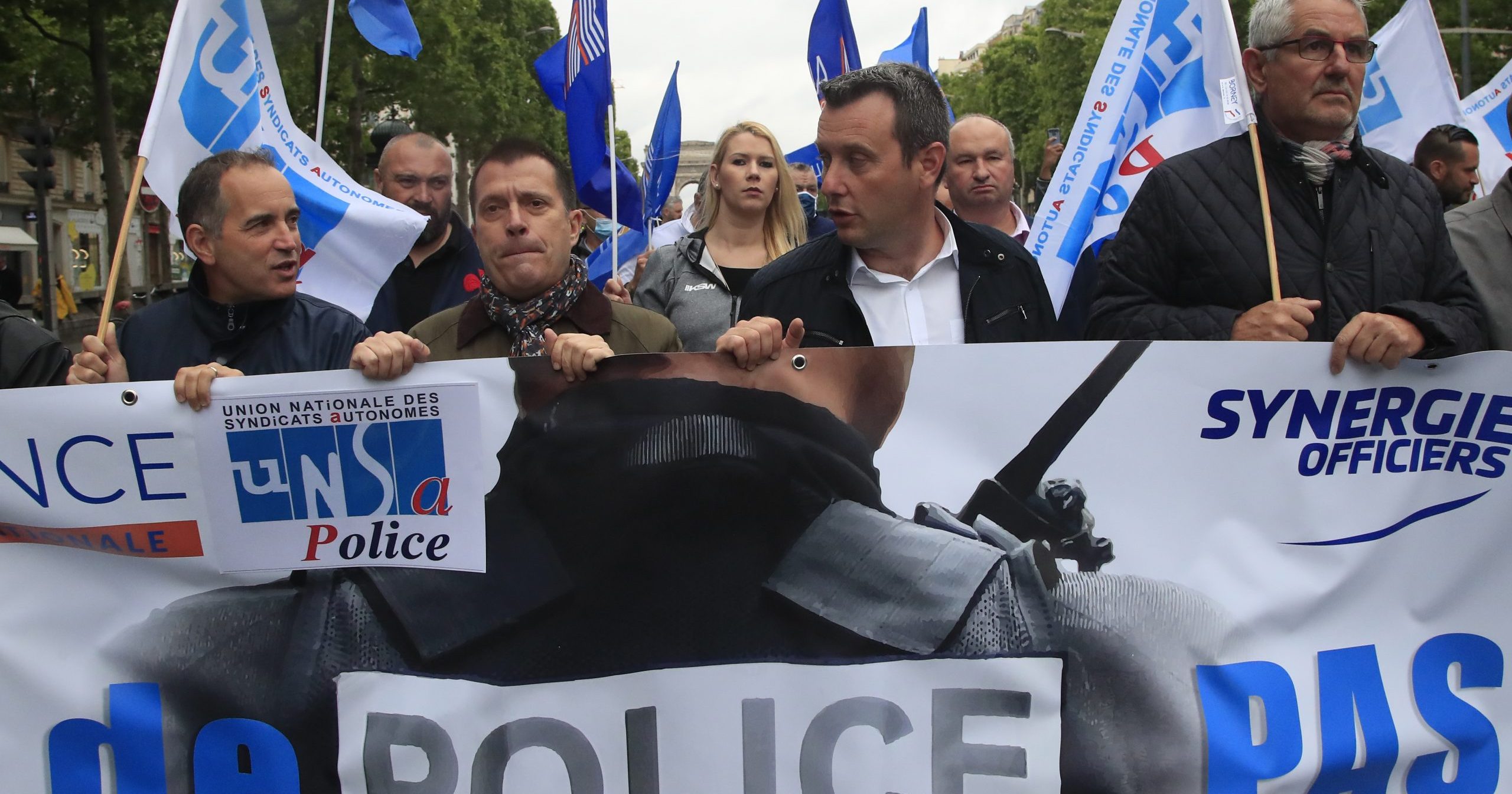 French police unionists demonstrate with a banner reading 'No police, no peace' on the Champs-Elysee avenue on June 12, 2020, in Paris. French police are protesting a new ban on chokeholds and implications of racism within their ranks.