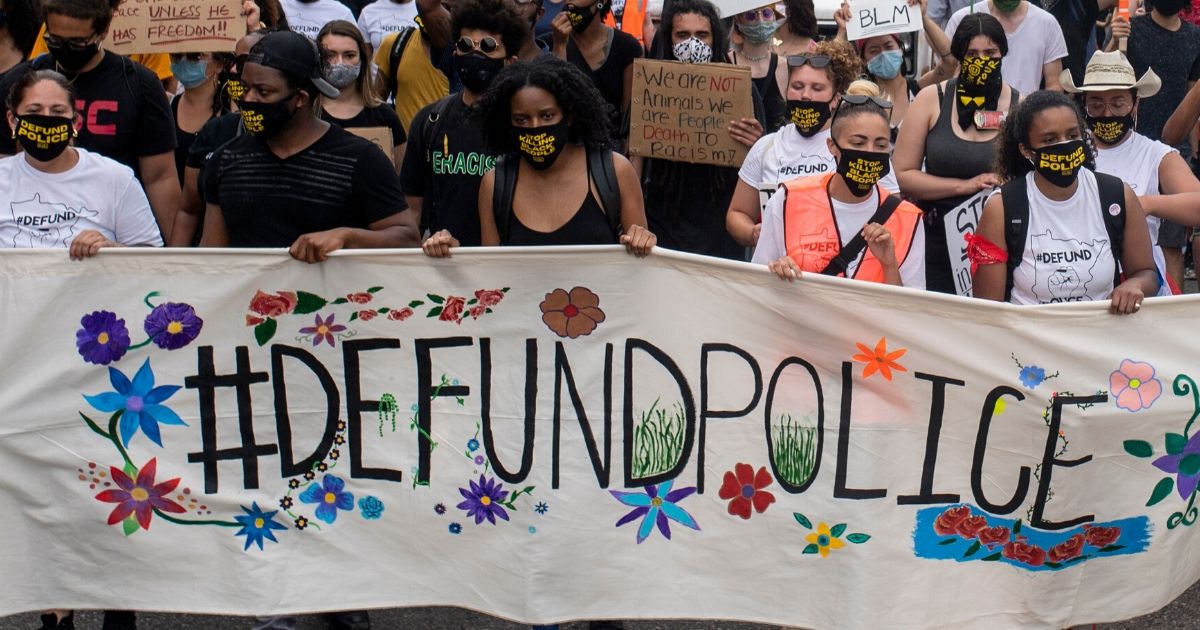 Demonstrators calling to defund the Minneapolis Police Department march on University Avenue on June 6, 2020, in Minneapolis.