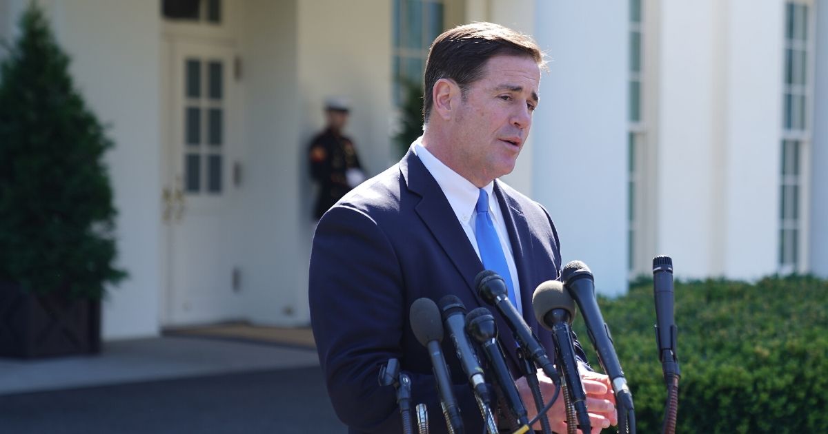 Arizona Gov. Doug Ducey talks to reporters after meeting with President Donald Trump at the White House on April 3, 2019, in Washington, D.C.