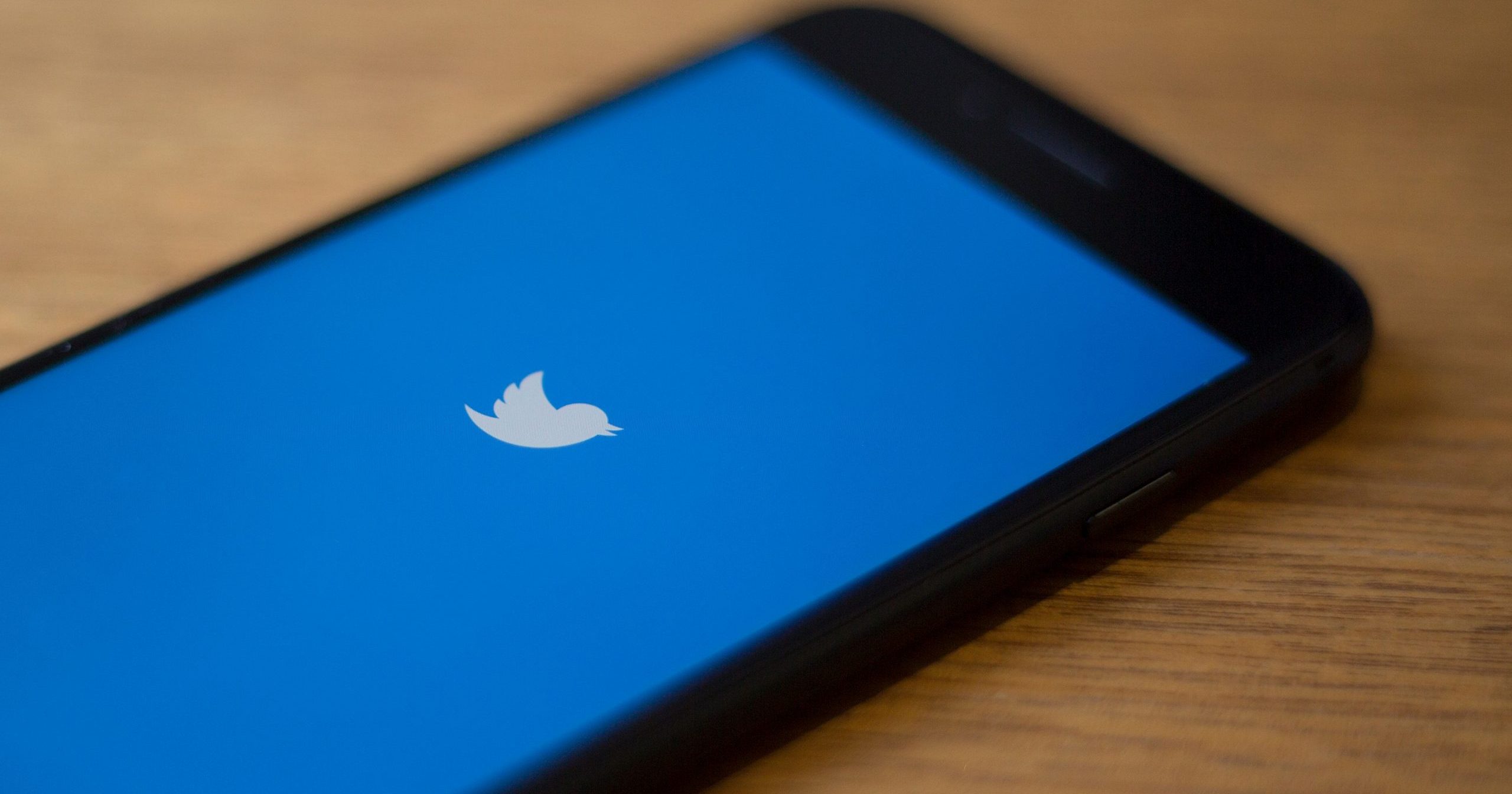 The Twitter logo is seen on a phone in this photo illustration in Washington, D.C., on July 10, 2019. (