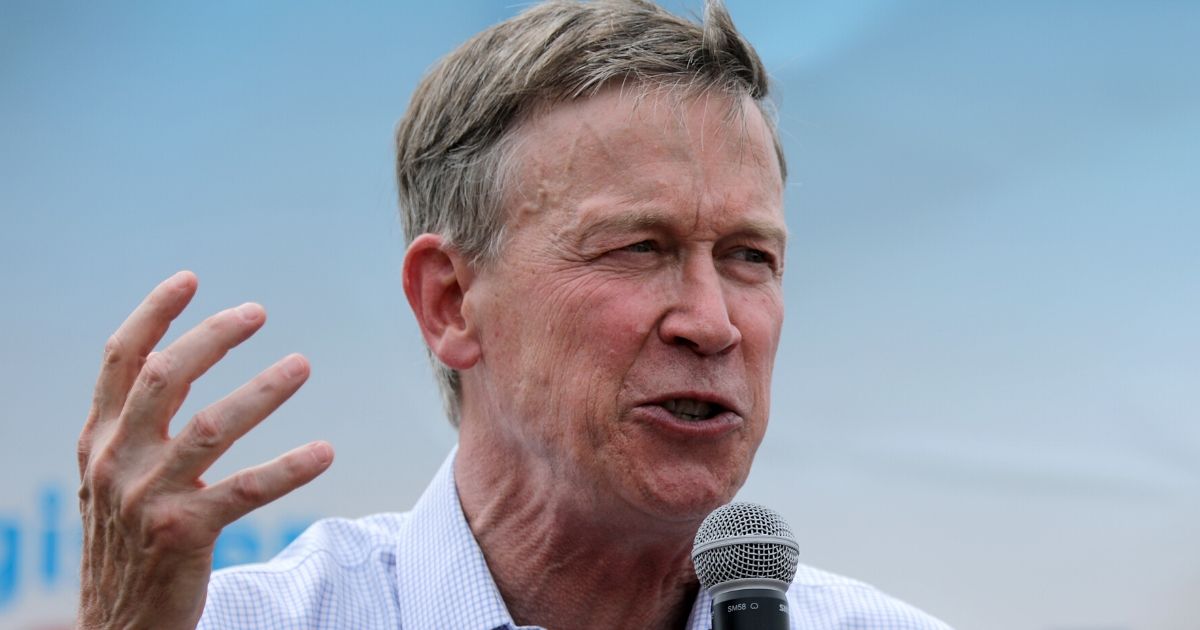 Former Colorado Gov. John Hickenlooper delivers a presidential campaign speech at the Iowa State Fair in Des Moines on Aug. 10, 2019.