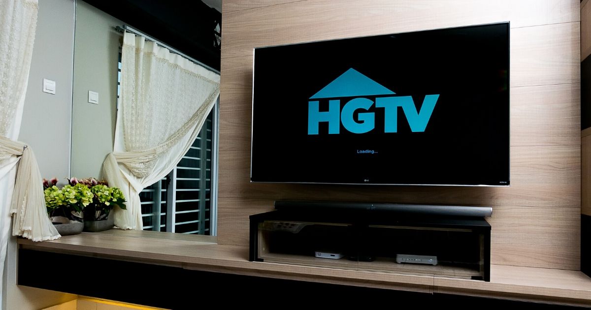 A television displaying the HGTV logo. House Hunters viewers have some strong feelings about the show, and they're coming up with some hilarious tweets.