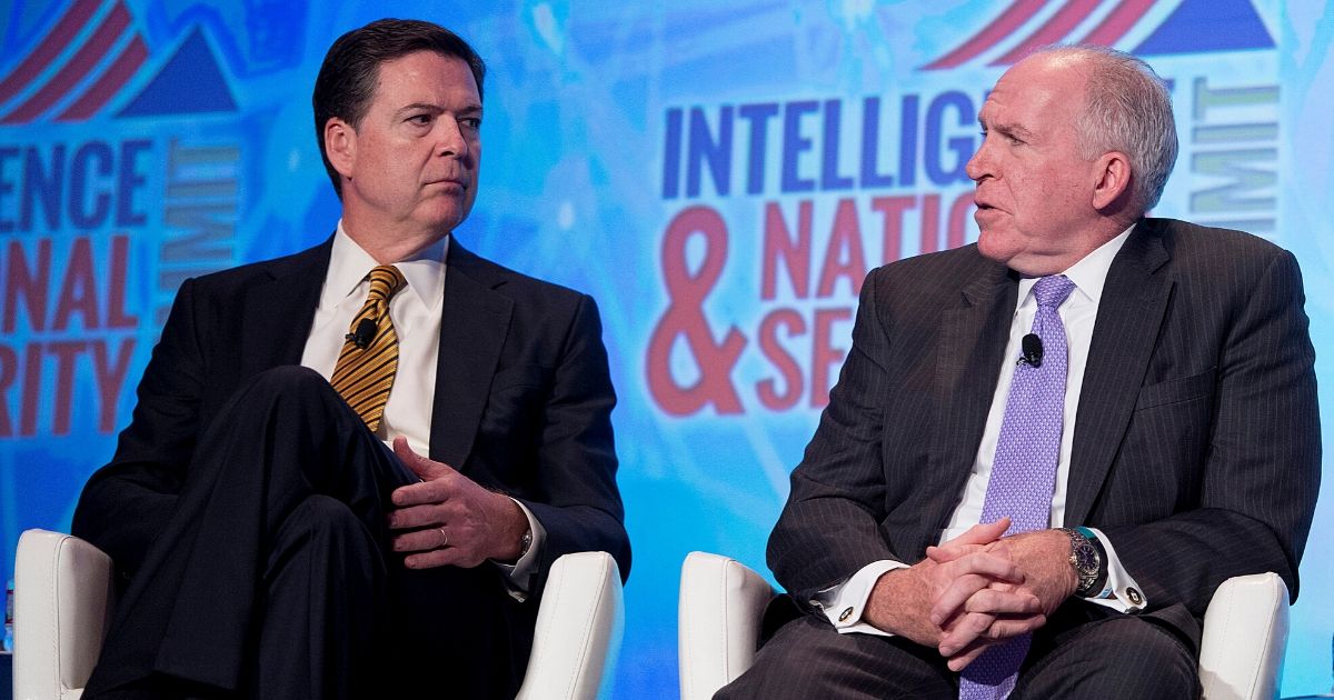 Then-FBI Director James Comey, left, and the 0 CIA Director John Brennan speak at the 2016 Intelligence and National Security Summit in Washington, D.C., on Sept. 8, 2016.