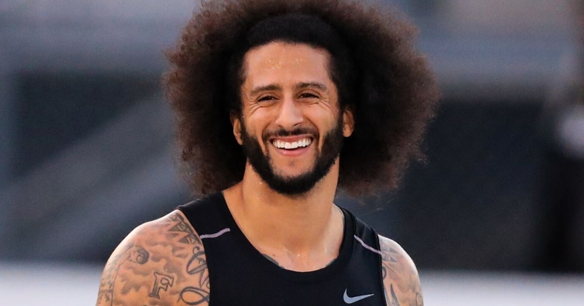 Colin Kaepernick smiles during a workout at Charles R. Drew High School in Riverdale, Georgia, on on Nov. 16, 2019.