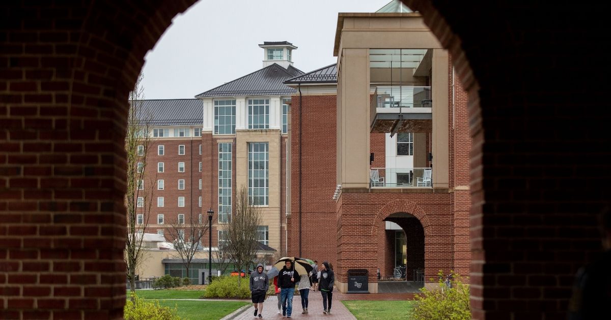 Students at Liberty University in Lynchburg, Virginia, walk around campus on March 31, 2020.