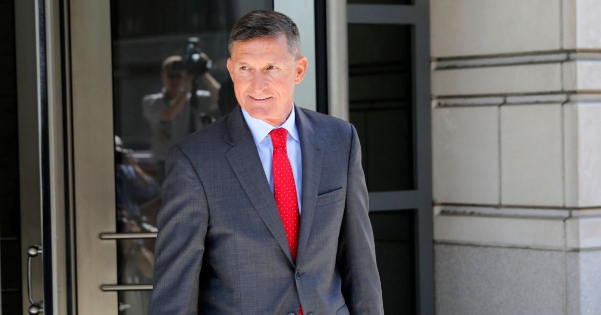 Michael Flynn, former national security advisor to President Donald Trump, departs the E. Barrett Prettyman United States Courthouse following a pre-sentencing hearing July 10, 2018 in Washington, D.C.