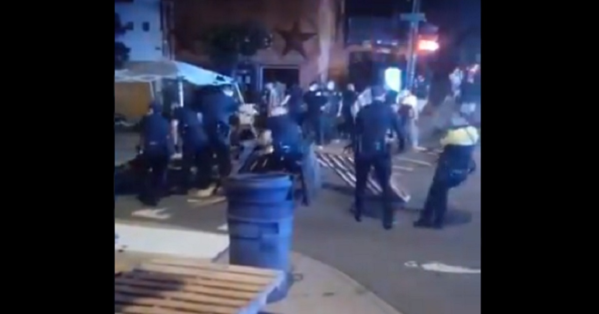 Police dismantle in Asheville, North Carolina, dismantle barricades protesters had attempted to put up to establish an "autonomous zone."
