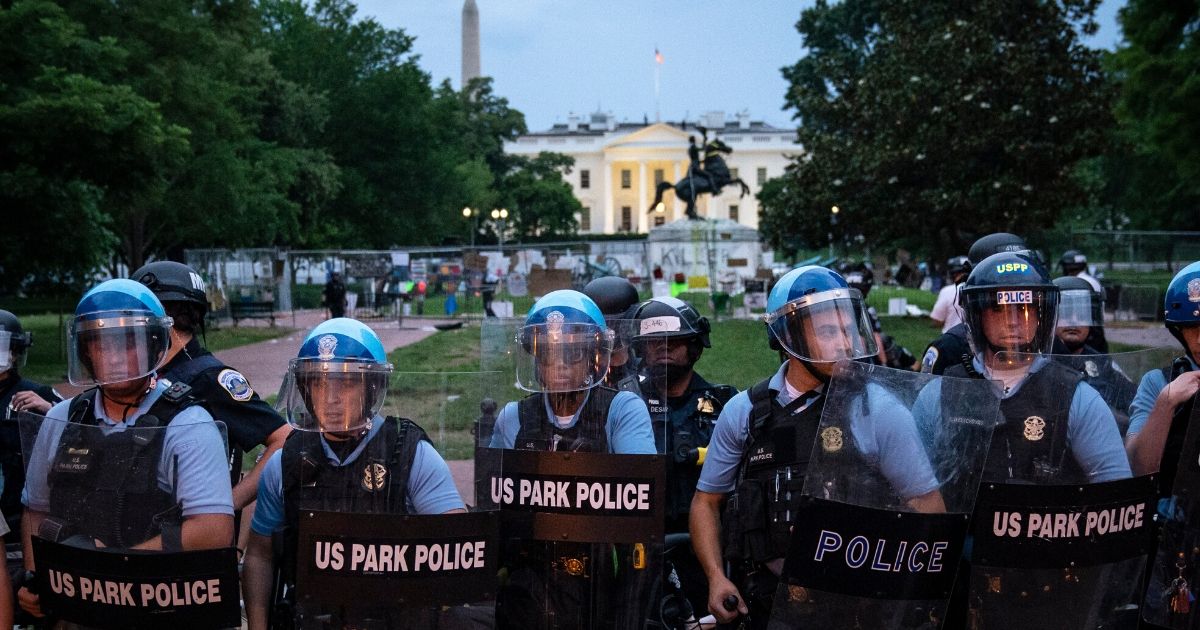 U.S. Park Police keep protesters back after they attempted to pull down the statue of Andrew Jackson in Lafayette Square near the White House on June 22, 2020, in Washington, D.C.