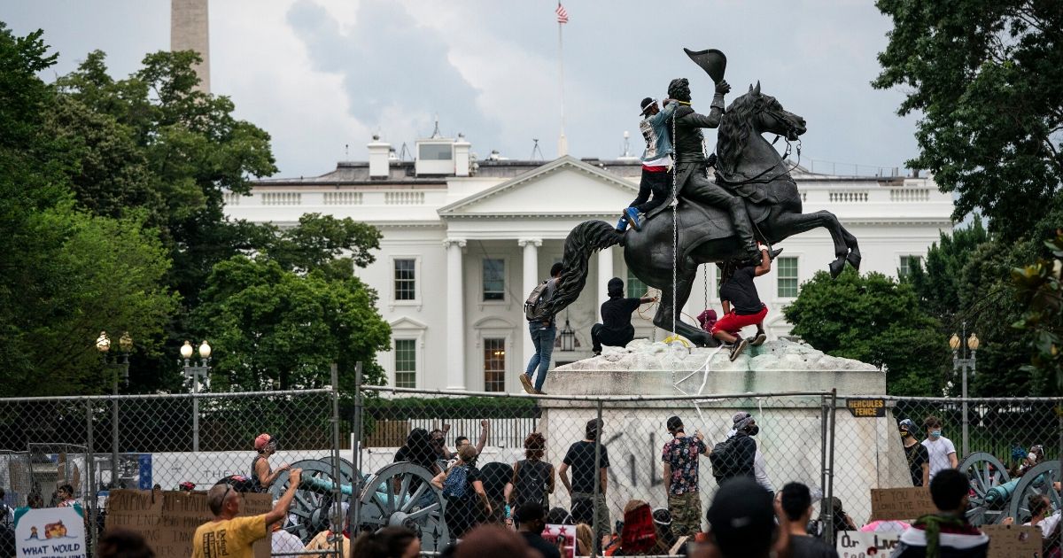 Protesters attempt to pull down the statue of Andrew Jackson in Lafayette Square near the White House on June 22, 2020, in Washington, D.C.