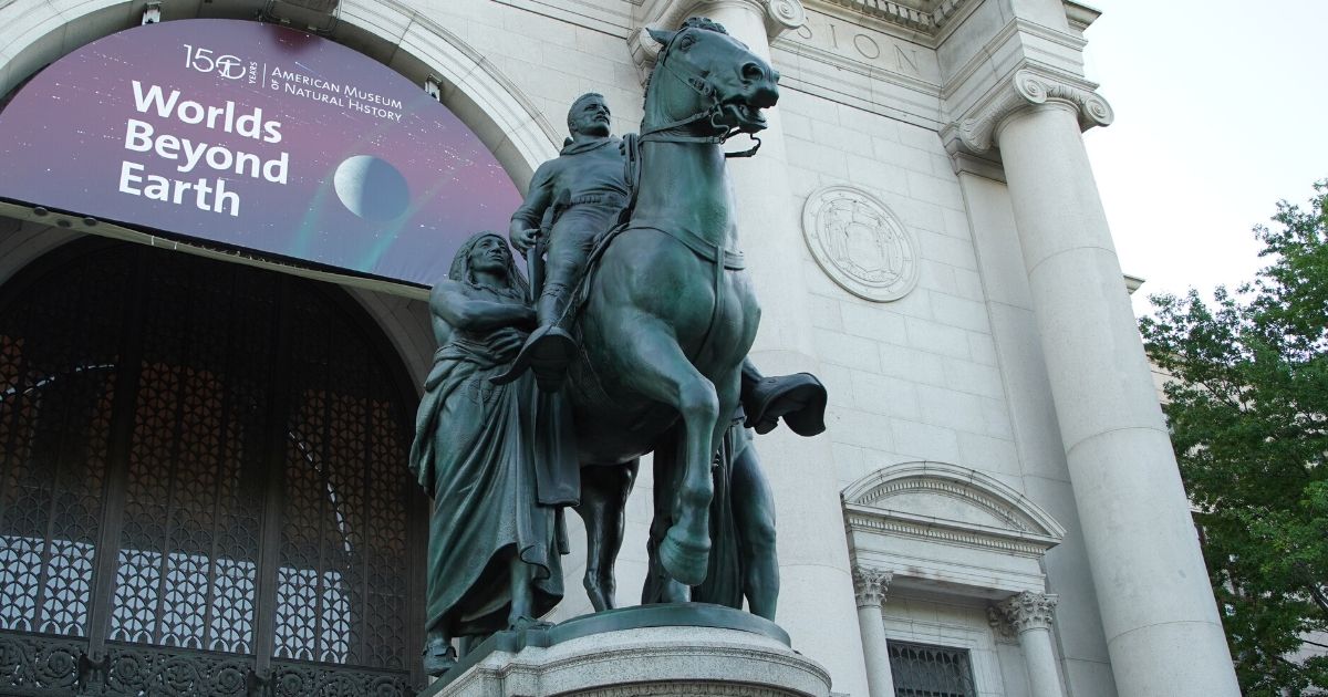 A statue of Theodore Roosevelt on horseback alongside Native American and African men, seen June 16, 2020, will be removed from the front of the American Museum of Natural History in New York City.