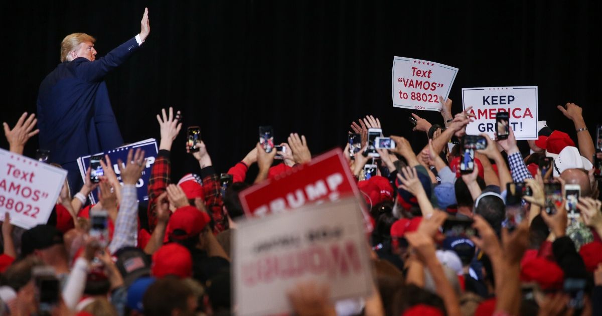 President Donald Trump waves to the crowd as he departs a campaign rally at the Las Vegas Convention Center on Feb. 21, 2020.