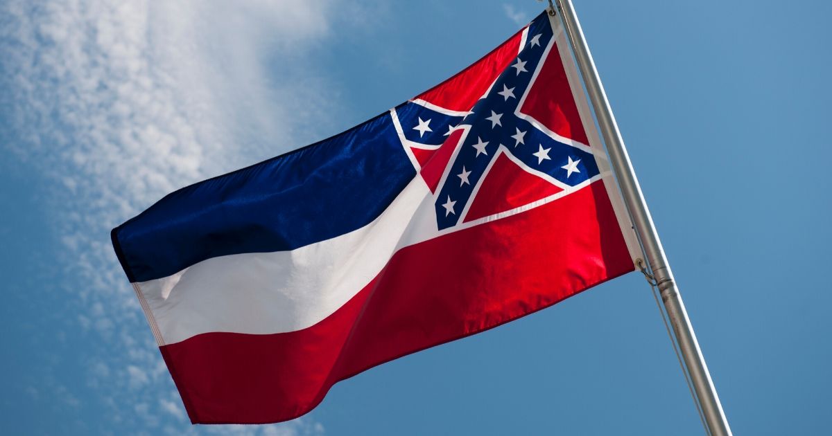 The Mississippi state flag is seen in this stock image.