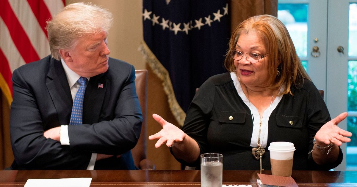 President Donald Trump listens to Dr. Alveda King, niece of Dr. Martin Luther King Jr., during a meeting with inner city pastors at the White House on Aug. 1, 2018.
