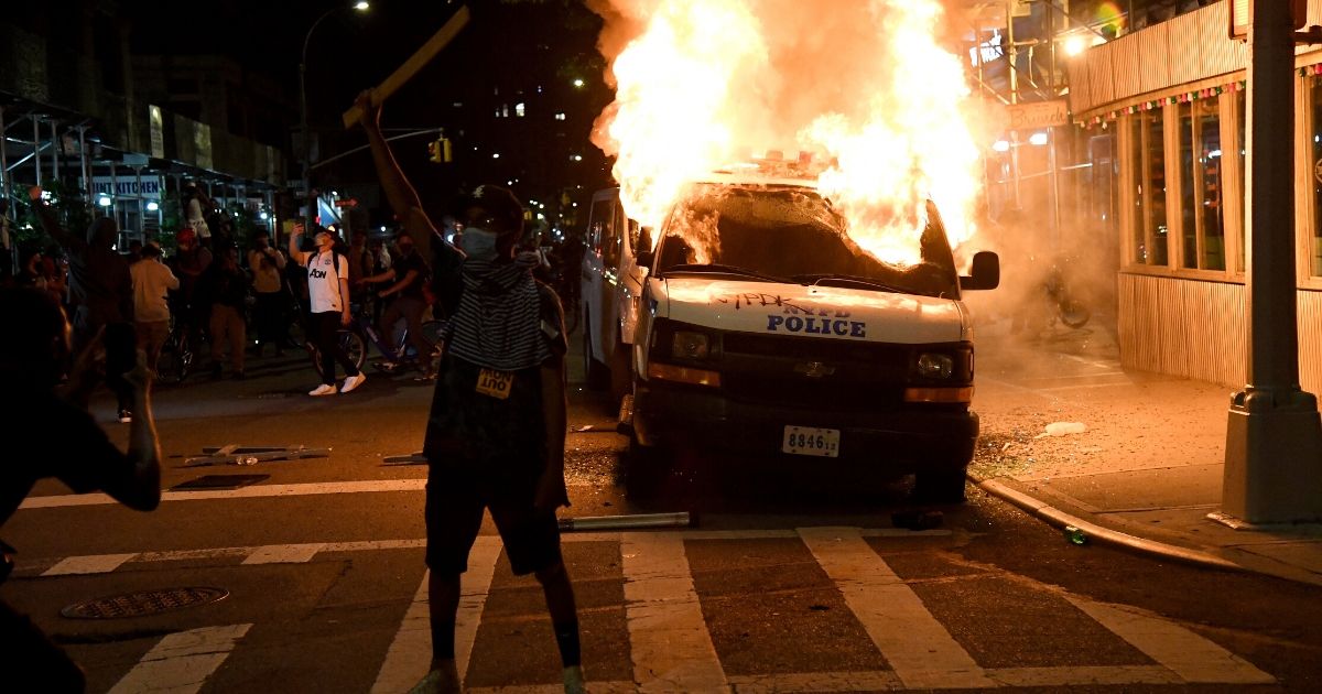 A New York City Police Department van burns near Union Square on May 30, 2020, in New York City.