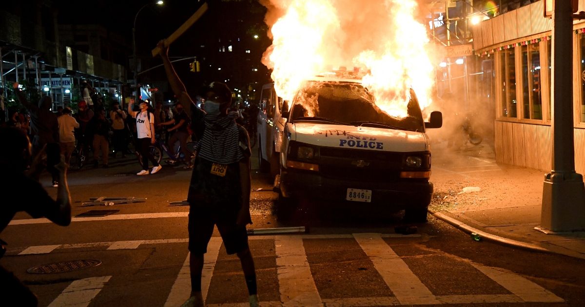 A New York City Police Department van burns near Union Square on May 30, 2020, in New York City.