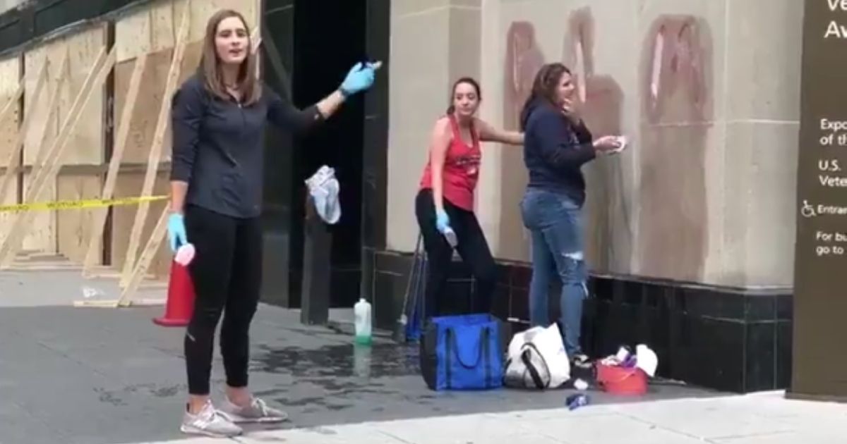 Three women are berated for cleaning up after vandals in Washington, D.C.