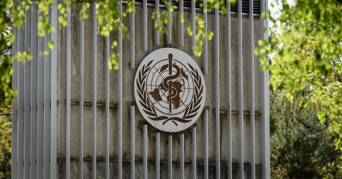 This picture taken on April 24, 2020, shows a sign of the World Health Organization in Geneva next to its headquarters.