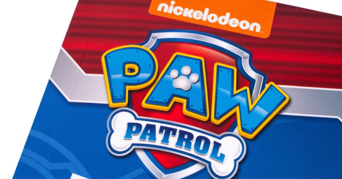 A close-up of the "Paw Patrol" logo on the front cover of a children's book.