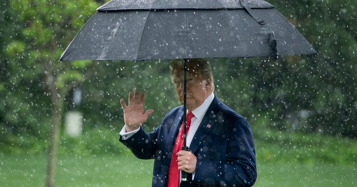 President Donald Trump walks to Marine One in the rain on the South Lawn of the White House on June 11, 2020, in Washington, D.C.