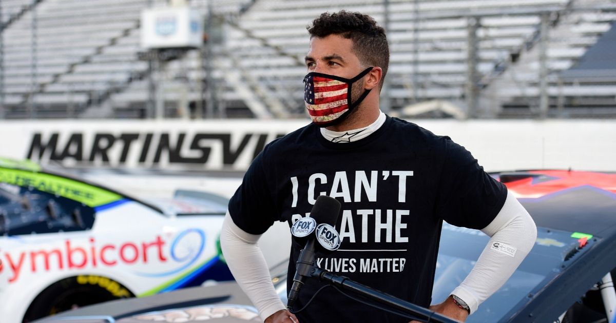 Bubba Wallace, driver of the #43 Richard Petty Motorsports Chevrolet, wears an "I Can't Breathe - Black Lives Matter" T-shirt prior to the NASCAR Cup Series Blue-Emu Maximum Pain Relief 500 at Martinsville Speedway on June 10, 2020, in Martinsville, Virginia.