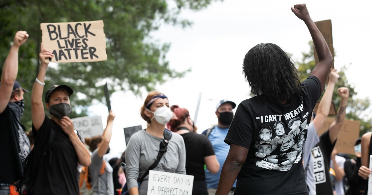 Black Lives Matter protesters march Monday in Stone Mountain, Georgia, site of a carving that depicts Confederate Gens. Robert E. Lee and Stonewall Jackson as well as Confederacy President Jefferson Davis.