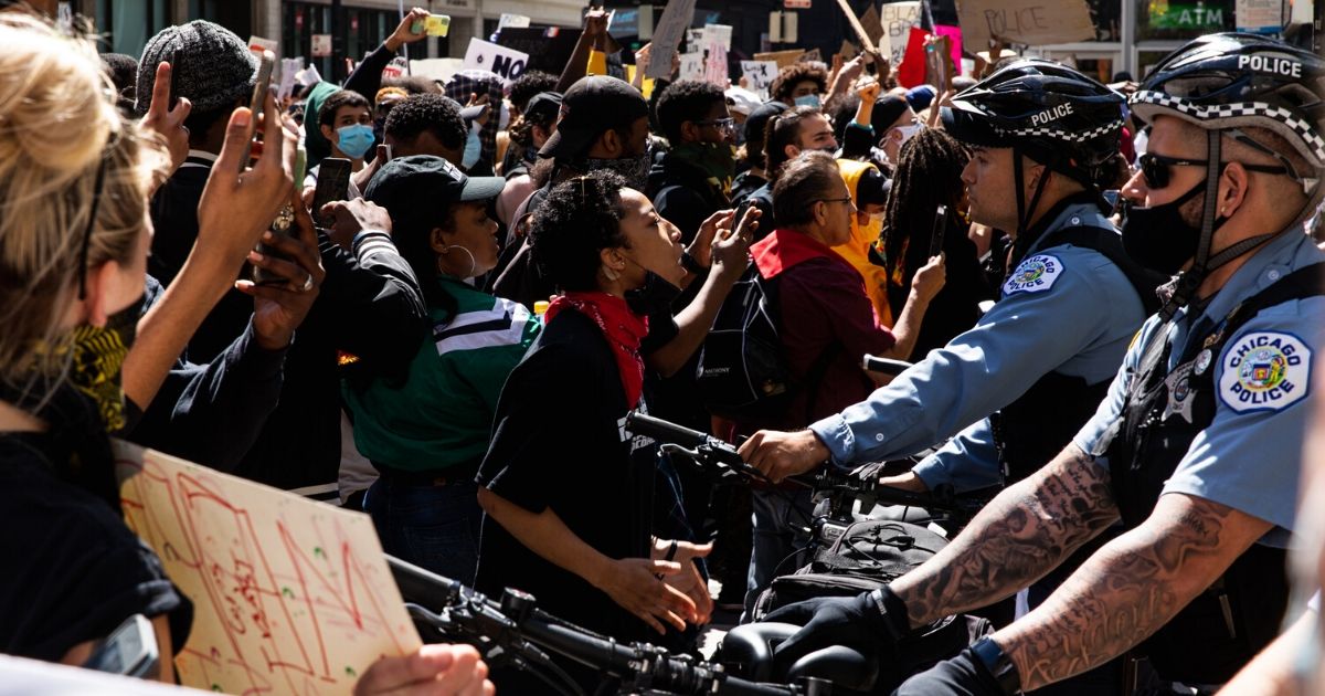 Protesters and Chicago Police clash during protests following the killing of George Floyd by Minneapolis police on May 30, 2020, in Chicago.