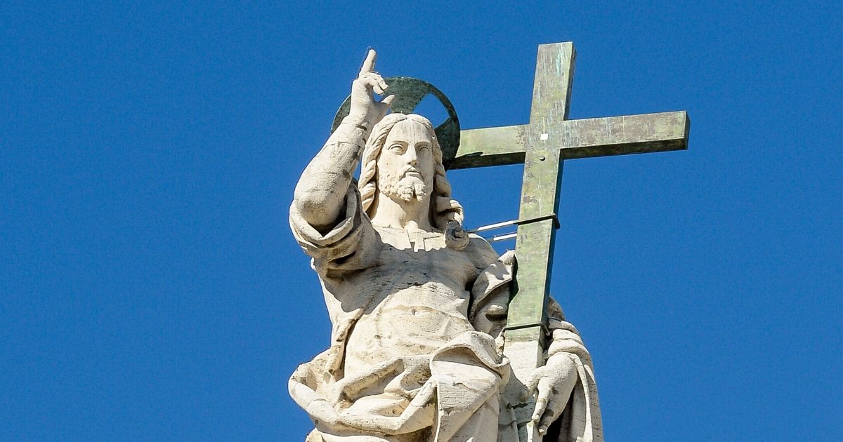 A statue of Jesus tops St. Peter's Basilica in Rome.