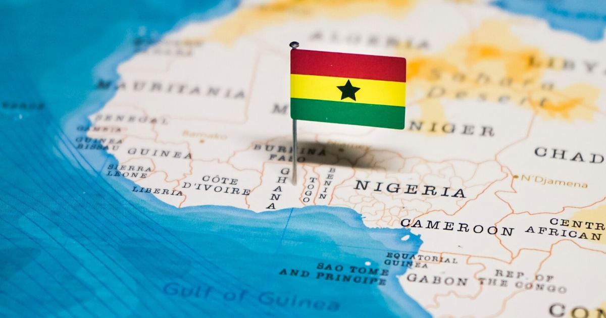 Stock image of the flag of Ghana on a map of Africa.