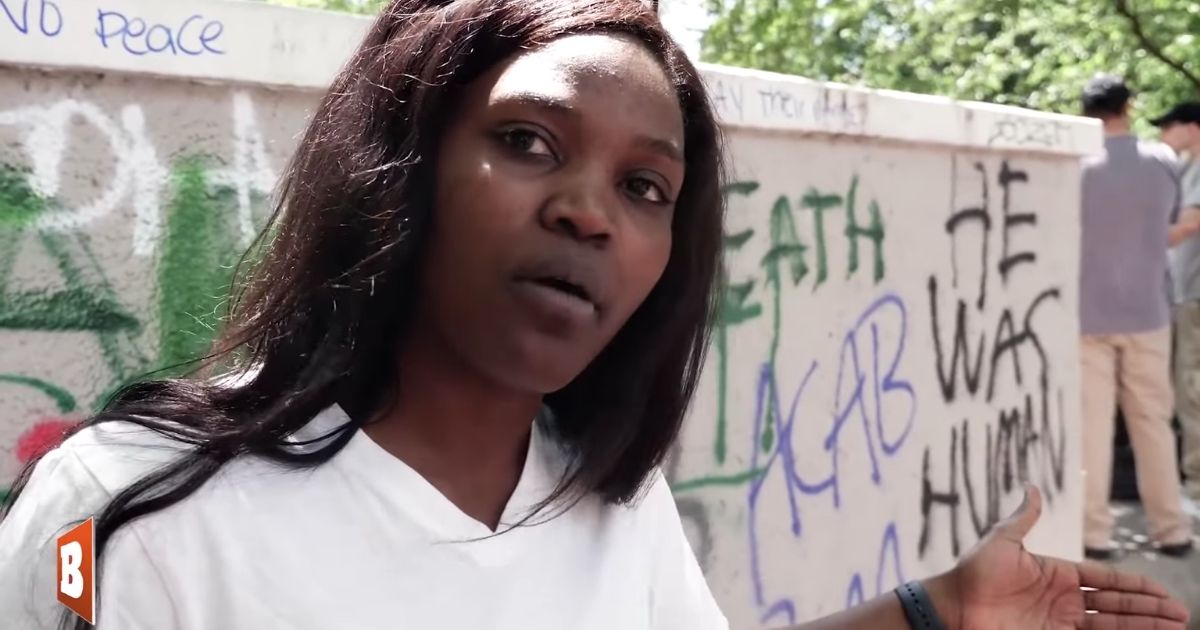 African immigrant Nestride Yumga talks with Black Lives Matter protesters in Washington, D.C.