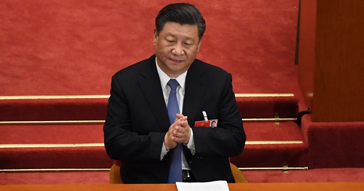 Chinese President Xi Jinping claps during the second plenary session of the National People's Congress in the Great Hall of the People in Beijing on May 25, 2020.