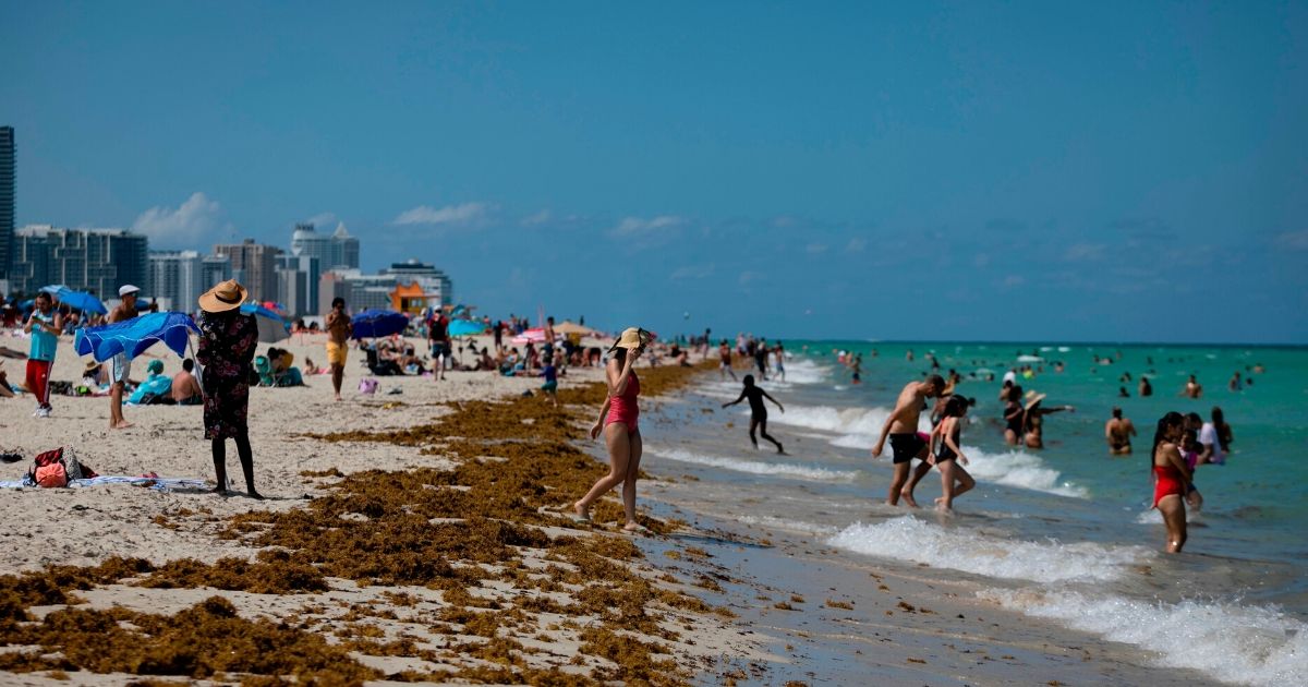 People gather on the beach in Miami Beach, Florida, on June 16, 2020.