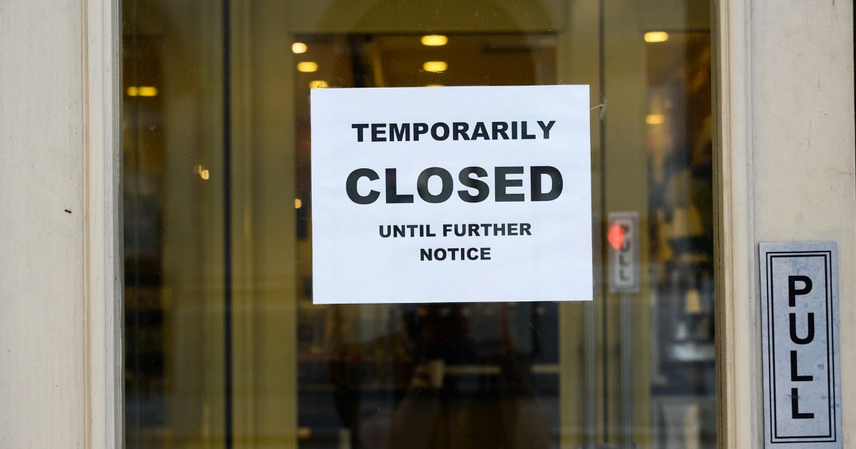 A "Temporarily Closed" sign is posted outside a food establishment during the coronavirus pandemic on May 24, 2020, in New York City.