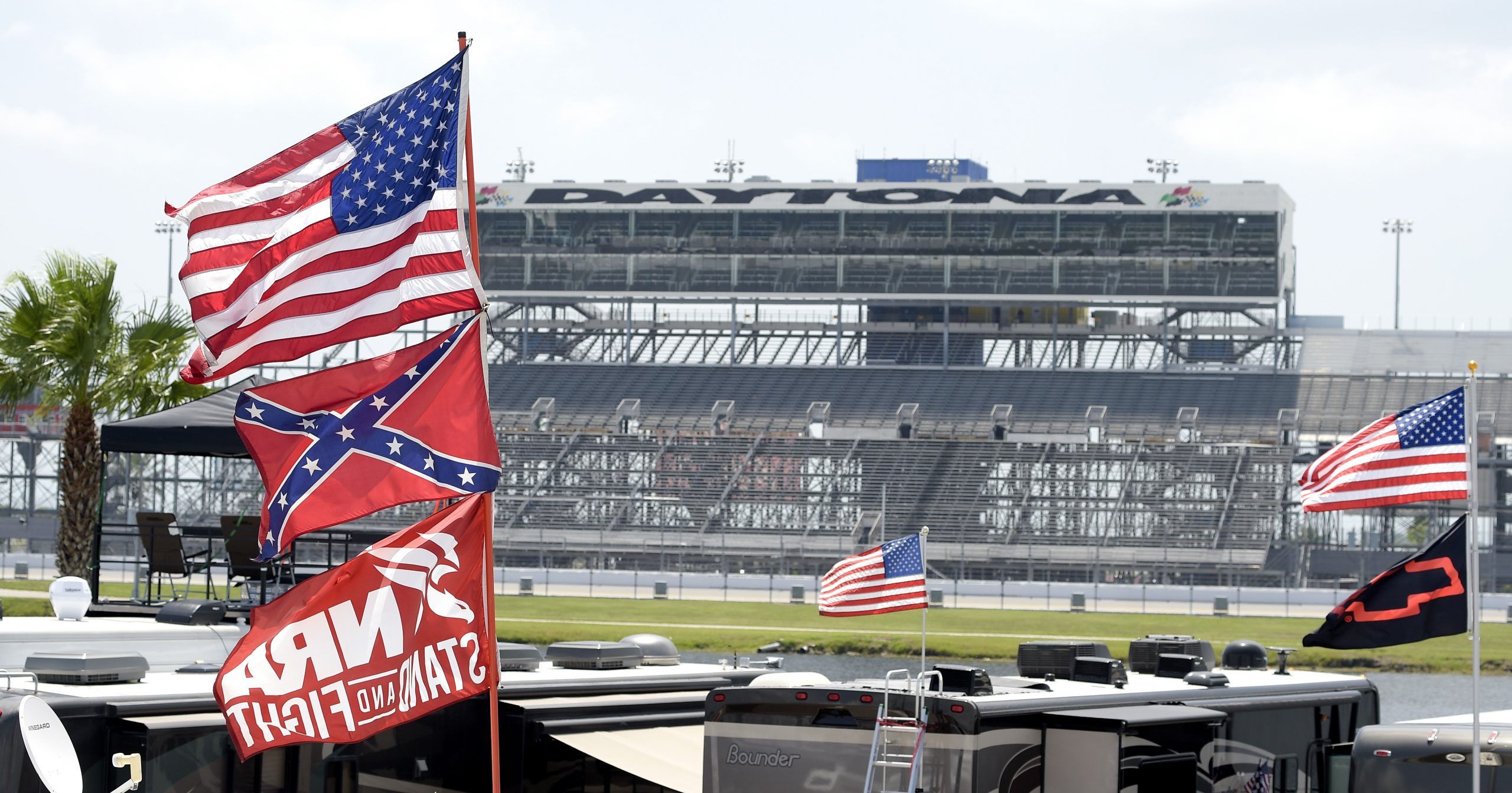 In this July 4, 2015, file photo, Confederate and American flags fly on top of motor homes at Daytona International Speedway in Daytona Beach, Florida.