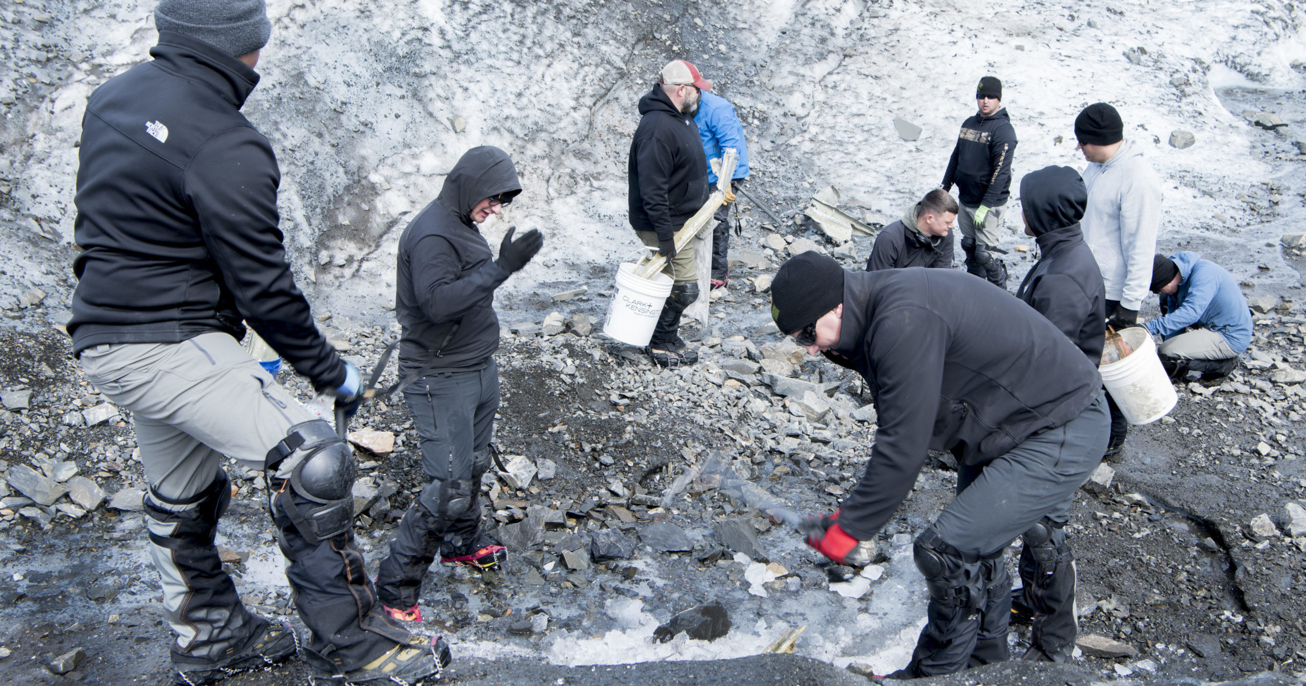 In this June 18, 2020, photo provided by U.S. Air Force Mortuary Affairs Operations, crash recovery team personnel assigned to Joint Base Elmendorf-Richardson, Alaska, search for crash remains at Colony Glacier, Alaska. A military plane carrying 41 passengers and 11 crew members crashed into a mountain near Anchorage in 1952, but remains of the victims are still being discovered.