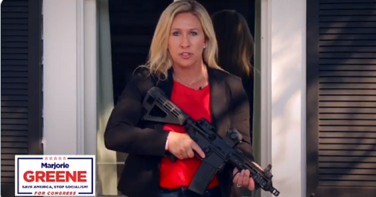 Marjorie Taylor Greene, a contender for the GOP nomination in Georgia's 14th Congressional District, holds and AR-15 while issuing a warning to antifa members in a recently posted campaign ad.