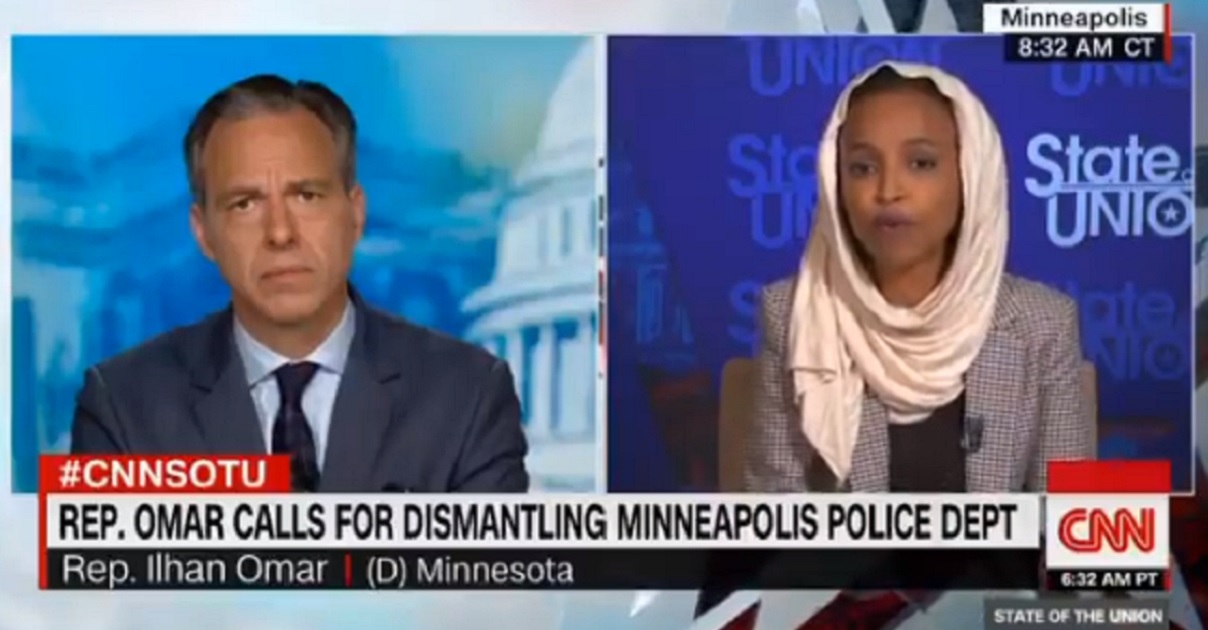 CNN's Jake Tapper, left, interviews Rep. Ilhan Omar, right, on "State of the Union" on Sunday.