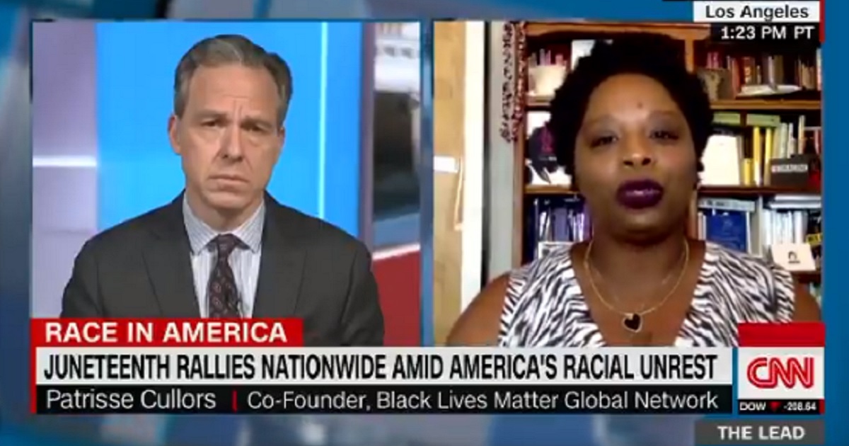 CNN's Jake Tapper, left; and Black Lives Matter co-founder Patrisse Cullors, right.