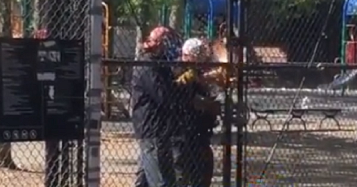 New York City employees weld the gates of a playground closed.