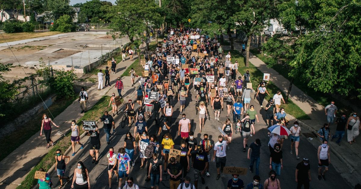 Protesters march in the street during a demonstration on June 25, 2020, in Minneapolis, Minnesota.