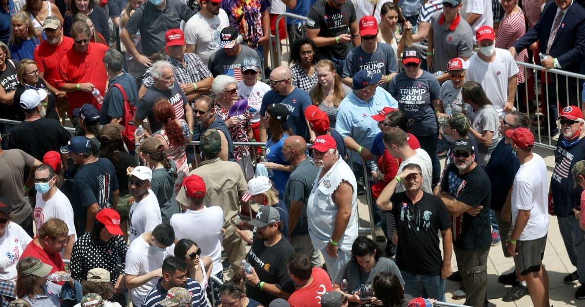 Supporters of President Donald Trump converge to enter a campaign rally on June 20, 2020, in Tulsa, Oklahoma. Trump is scheduled to hold his first political rally since the start of the coronavirus pandemic at the BOK Center.