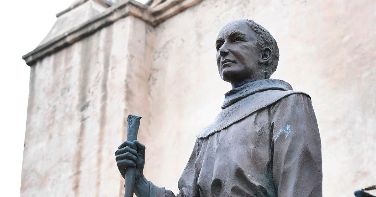 A statue of St. Junipero Serra is seen in front of the San Gabriel Mission in San Gabriel, California, on June 21, 2020.